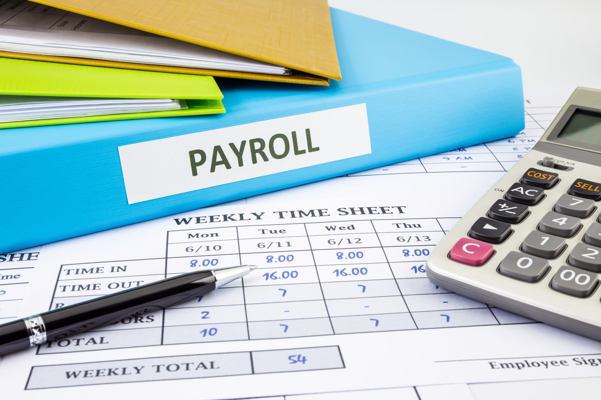 Payroll Documents and a Calculator